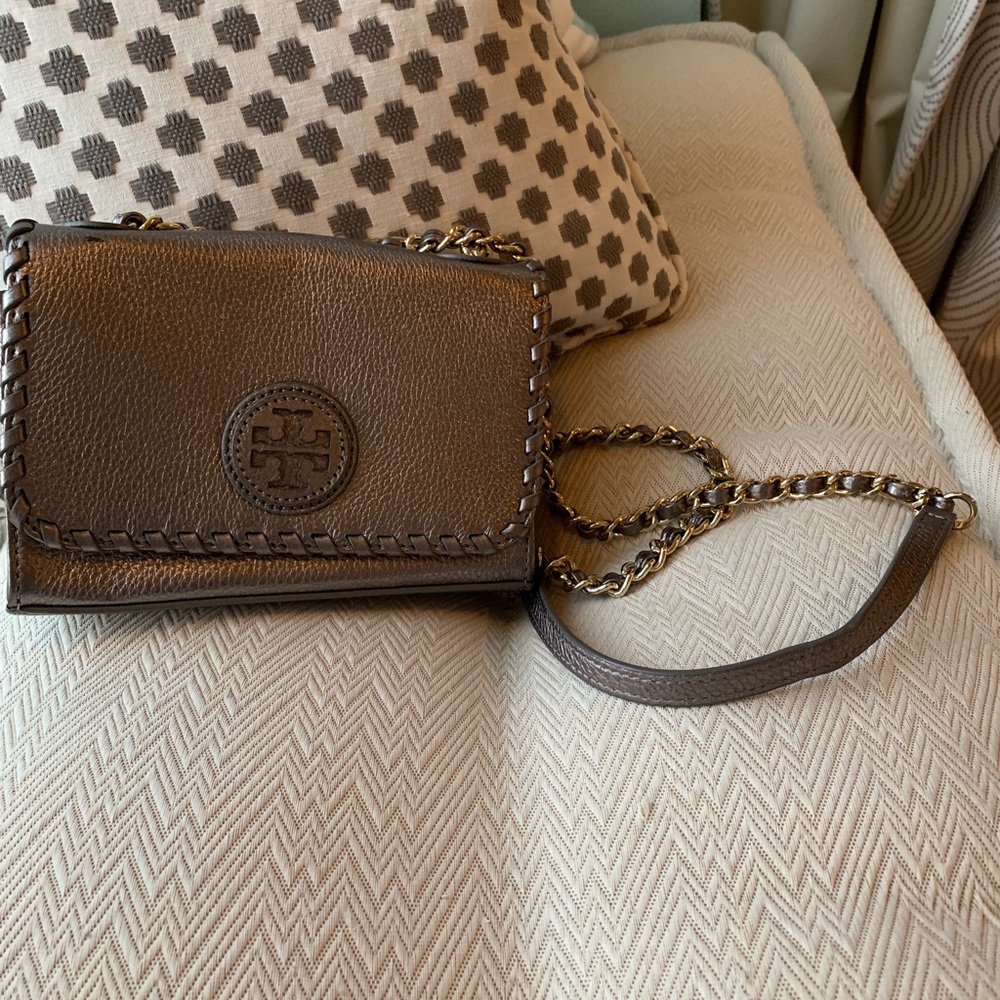 Silver metallic Tory Burch purse with strap